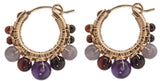 Pair of gold hoop earrings with purple beads